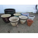 9 ceramic garden plant pots. Largest is H34cm approx