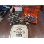 A canteen of cutlery, Breweriana tray, metal goblets, a trinket pot and a carriage clock