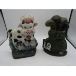 Cast iron doorstops- a golf bag and 'silly cow'