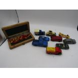 A mini chess set and collection of cars