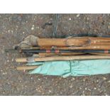 Vintage fishing rods and umbrella