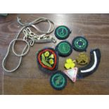 Girl guides badges, patches a chain and a bracelet