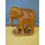 A large treen elephant carved in teak 31"