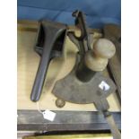 Vintage cast iron kitchenalia-masher and a slicing tool