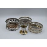 Three silver-plate wine coaster and a silverplate match holder