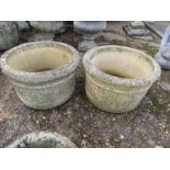 A pair of sanford stone plant pots 11" tall and 18" across top