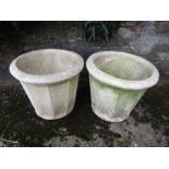 A pair of stone plant pots 13" tall 14" across top