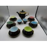 Stavangerflint tea set for 6, black with a gold trim and pastel coloured inside