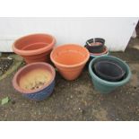 Ceramic plant pot and plastic plant pots. Tallest H37cm approx