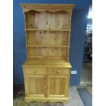 Pine dresser with 2 drawers and 2 door cupboard to base with shelving above H196cm W95cm D42cm