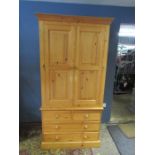 Solid pine 2 door wardrobe sitting on 2 short over 2 long drawers H195cm W99cm d59cm approx