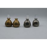 Four engraved silver and silver gilt mounted glass bottle stoppers. hallmarked Birmingham 1830's