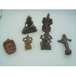 A collection of vintage 'bronze' Tibetan deities (4) plus one carved wooden, and a scent bottle