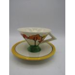 A Clarice Cliff style art deco teacup and saucer by pastimes in 'tall trees' design