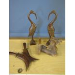 Treen herons, a dragon and carving set