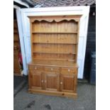 Pine dresser with 3 drawers and 3 door cupboard to base with shelving above H198cm W128cm D47cm