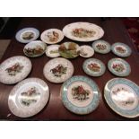 A collection of hunting themed plates and a clock