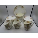 Vintage floral part tea set comprising 1 cake plate, 1 large bowl, 11 small plates, 11 saucers and 6
