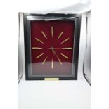 Cartridge display board in the form of a clock with quartz movement framed 44 x 54cm