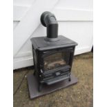 Electric wood burning stove with flue and hearth