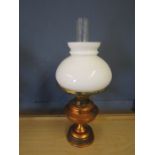 Brass base oil lamp with white glass shade and funnel