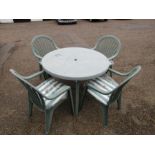 Green plastic garden table and 4 chairs with new seat pads