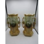 A pair of Minster handled vases with pheasant design