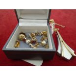 A box of about 6 pairs of stud earrings, some gold plus a pendant on a 9ct gold chain