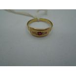 9ct gold ring with one large red stone with smaller white and red stones either side, 2,8g