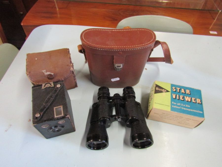 Camera, binoculars and Boots viewer