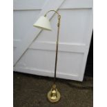 Adjustable brass floor lamp with shade