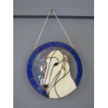 A signed stained glass plaque of a Saluki signed L&E Kaun