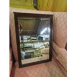 Bevelled wall mirror with mahogany frame 38cm x 54cm approx