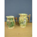 A pair of Majorcan jugs depicting birds of prey tallest 23cm