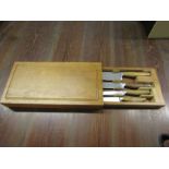 Wooden handled knife set in chopping board case