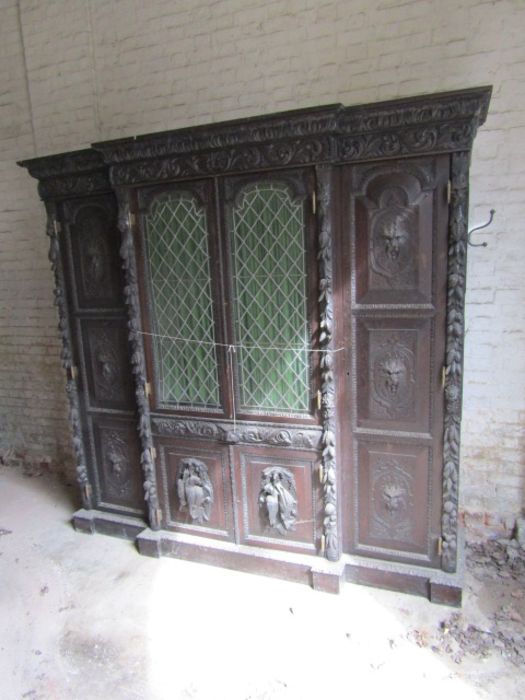 Carved oak Hunters cabinet with 2 central leaded glass doors above 2 door cupboard, flanked by - Image 2 of 9