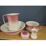 A vintage water set in pink and white with lustre glaze