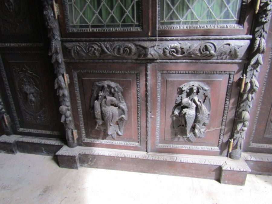 Carved oak Hunters cabinet with 2 central leaded glass doors above 2 door cupboard, flanked by - Image 8 of 9
