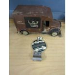 80 yrs of Morgans car badge and a tin van model