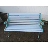 Painted cast iron garden bench with wooden slats