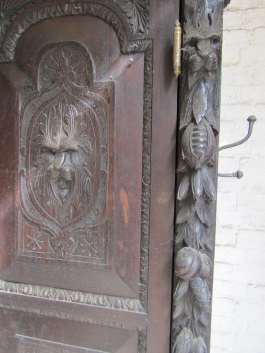 Carved oak Hunters cabinet with 2 central leaded glass doors above 2 door cupboard, flanked by - Image 7 of 9