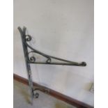 A wrought iron sign bracket 71" long