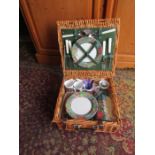 Wicker picnic basket with contents