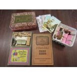 Stamps, Downham postcards, Cigarette cards, wooden puzzle, printing outfit and a boxed lighter