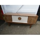 Mid century sideboard with 2 door central cupboard flanked by a further door under drawer each