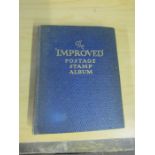 Small "Improved" school boy stamp album containing mostly British Empire stamps, early to modern.