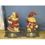 A pair of cast iron punch and judy door stops 13" tall