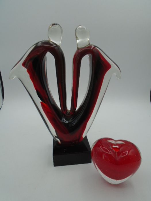 red and black glass abstract sculpture in the style of Murano and a glass heart paperweight