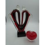 red and black glass abstract sculpture in the style of Murano and a glass heart paperweight