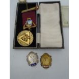 Gold ballroom dancing medal- 9.3 grams, a silver ballroom dancing medal 8.9 grams and a silver